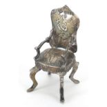 Theodore Hartmann, Edwardian silver doll's house chair embossed with a shepherd and girl with a