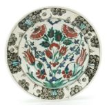 Middle Eastern Iznik style pottery bowl hand painted with flowers, 26cm in diameter