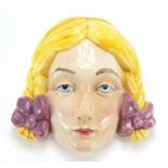 Art Deco Beswick face mask of a young female, 20.5cm high