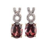 Pair of 9ct gold red and clear stone stud earrings, 1.5cm high, 2.5g