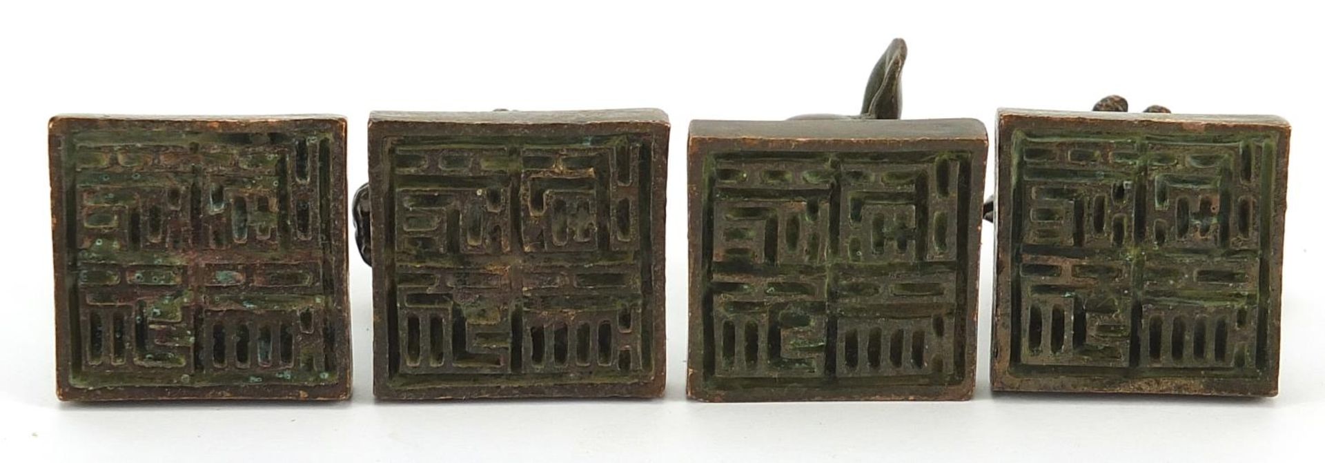 Four Chinese patinated bronze desk seals, the largest 4cm high - Image 3 of 3