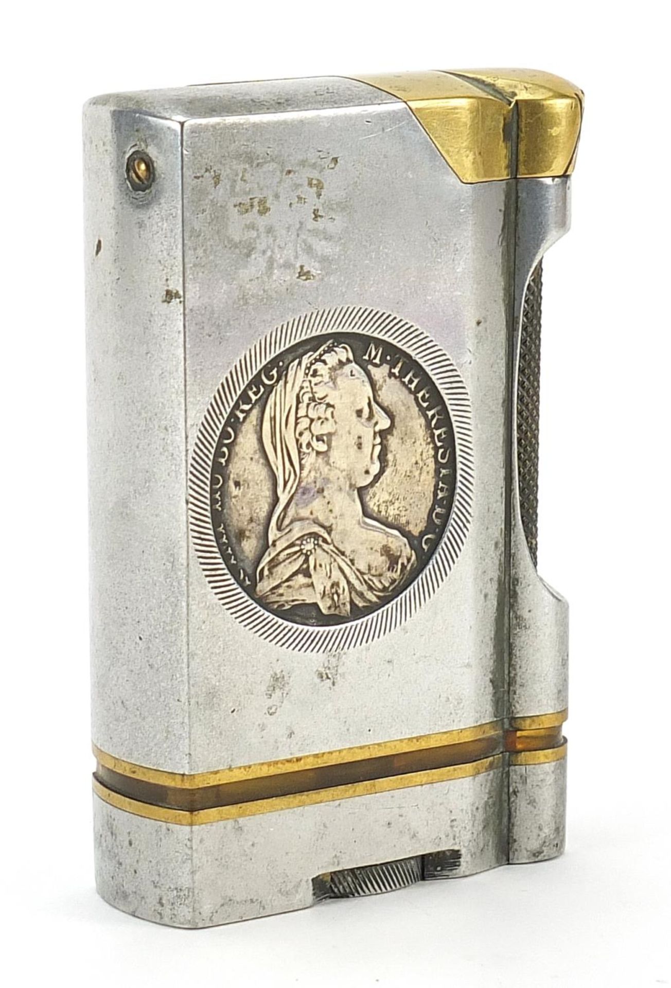 White metal and brass table lighter inset with a coin, impressed Canmiss to the base, 10.5cm high