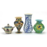 Palestinian pottery including three vases hand painted with flowers, the largest 20.5cm high