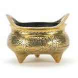 Chinese bronze tripod incense burner with twin handles engraved with figures and waves, six figure