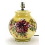 Moorcroft pottery table lamp hand painted with flowers, 23cm high