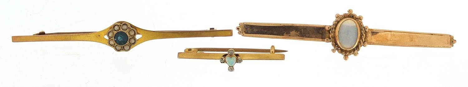 Three gold bar brooches, two unmarked, set with opal, diamonds, blue stone and seed pearls, the