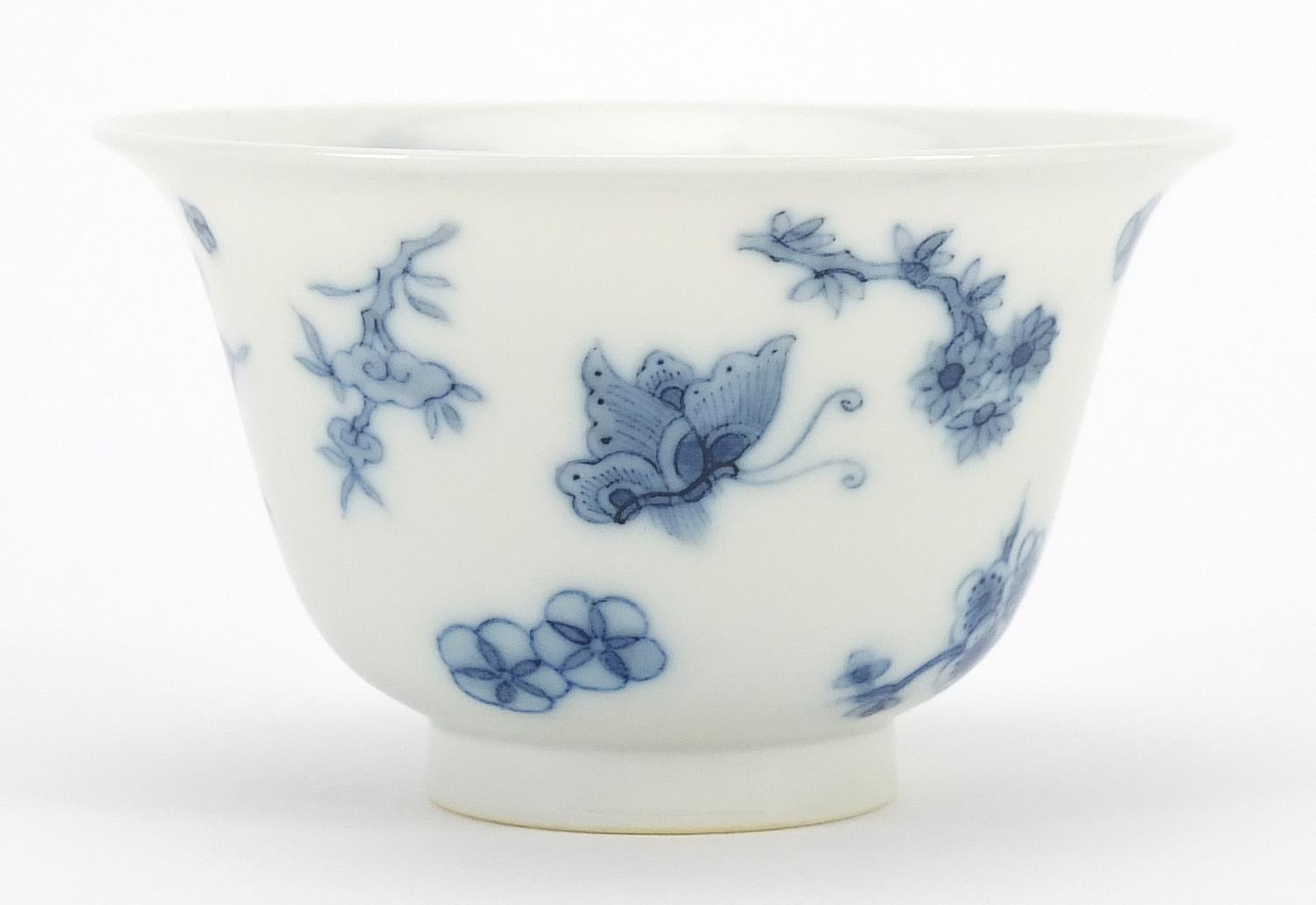 Chinese blue and white porcelain tea bowl hand painted with butterflies amongst flowers, six