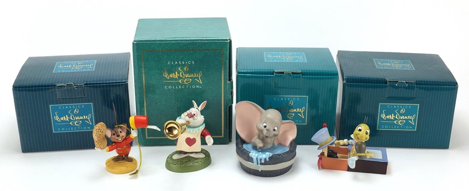 Four Walt Disney Classics Collection figures with boxes and certificates comprising Dumbo, White