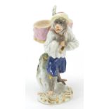 Meissen, German porcelain figure of a monkey carrying two drums, numbered 60003 to the base, 14cm