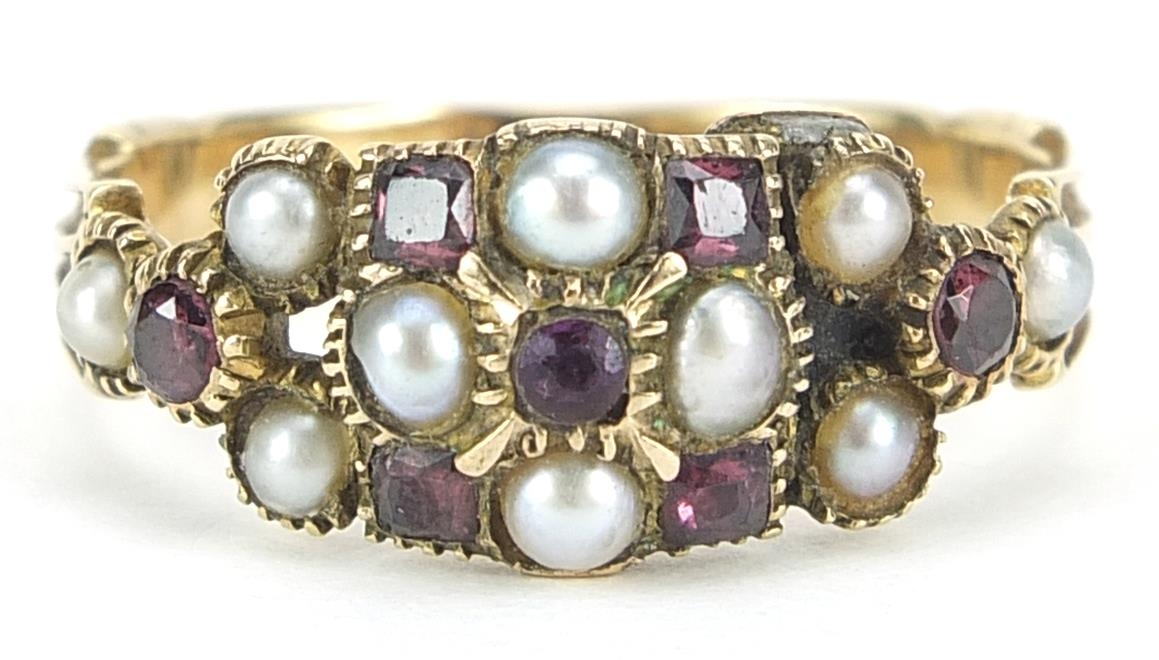 Early 19th century unmarked gold seed pearl and garnet cluster ring, size P, 3.4g