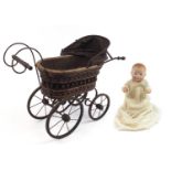 German Koppelsdorf bisque head doll with open close eyes and a Victorian doll's pram, 73cm in length