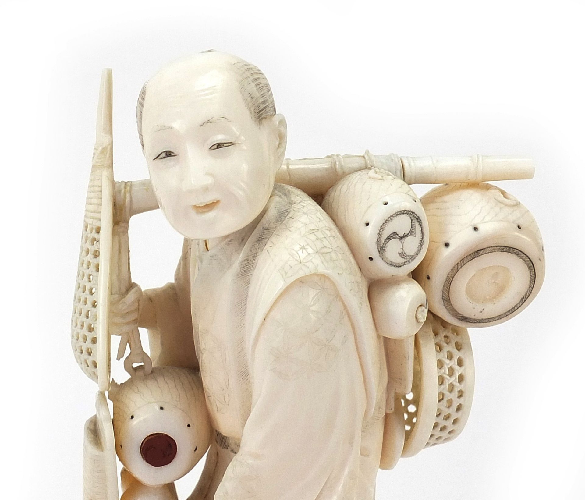 Good Japanese carved ivory okimono of a fisherman raised on a hardwood stand, inset red plaque - Image 2 of 9