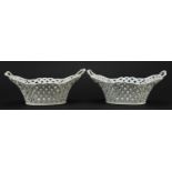 Meissen, Pair of German porcelain pierced baskets with twin handles, each 26.5cm wide