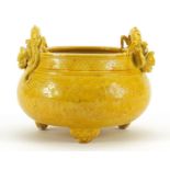 Chinese porcelain yellow glazed tripod censer with dragon handles, incised under glaze with a dragon