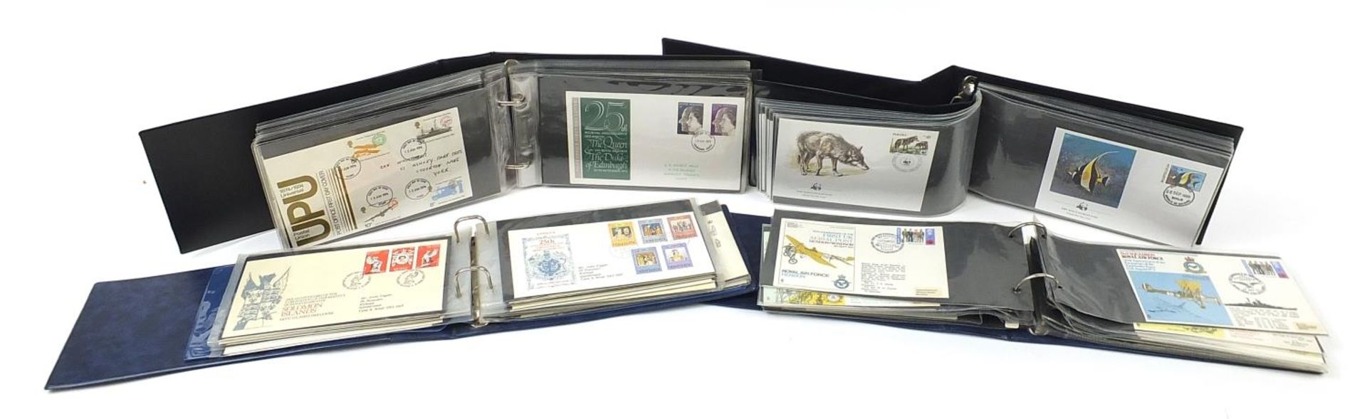 Four albums of first day covers