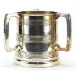 Elkington & Co silver plated tyg with glass base, 18cm high