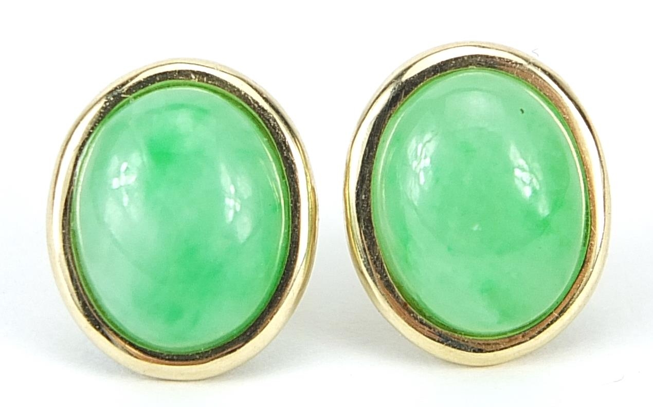 Pair of 14ct gold and cabochon green jade stud earrings, 1.2cm high, 2.3g