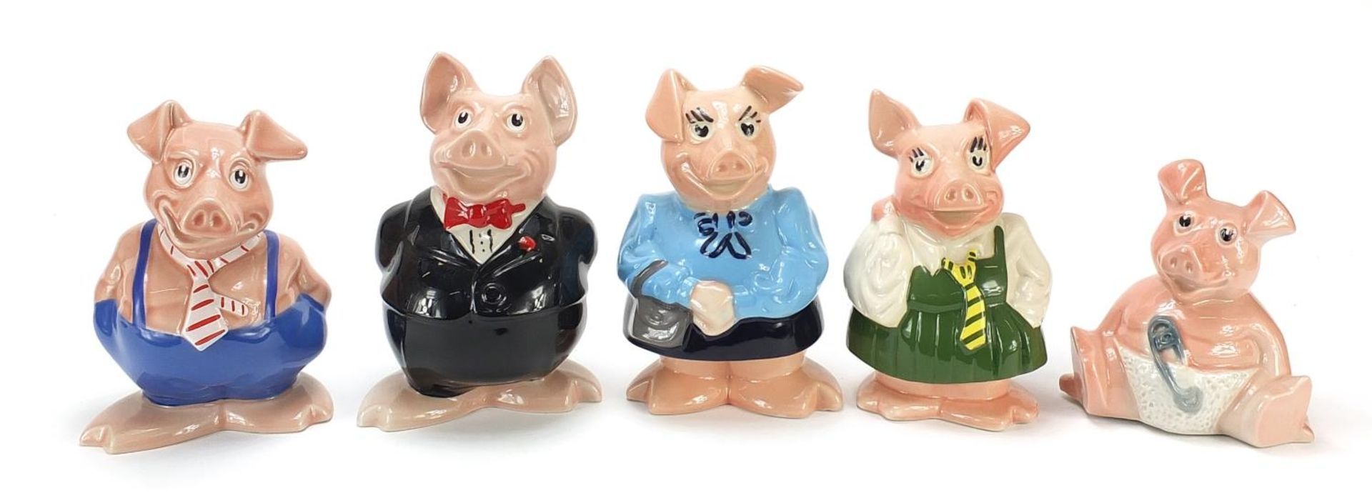 Set of five NatWest piggy banks, the largest 18.5cm high