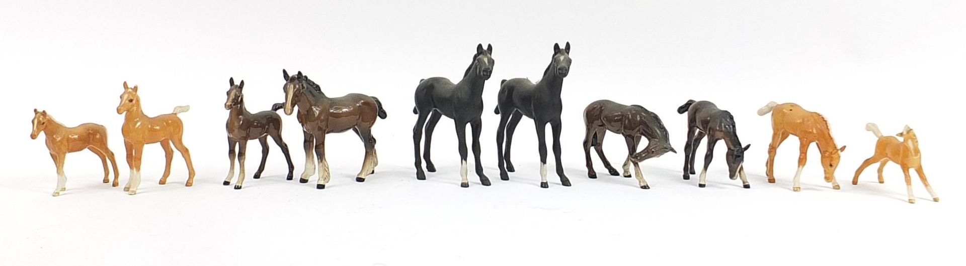 Nine Beswick horses and a Royal Doulton horse, the largest 14.5cm high