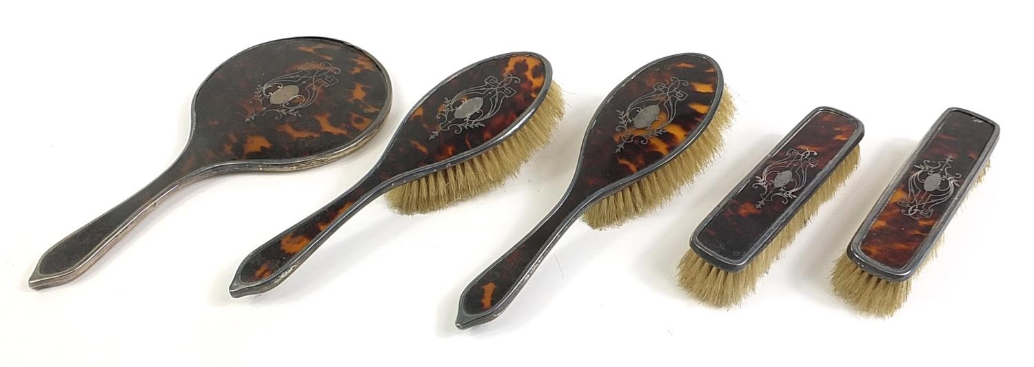 George V silver and tortoiseshell pique work dressing table set, C & A makers mark, London 1920, the