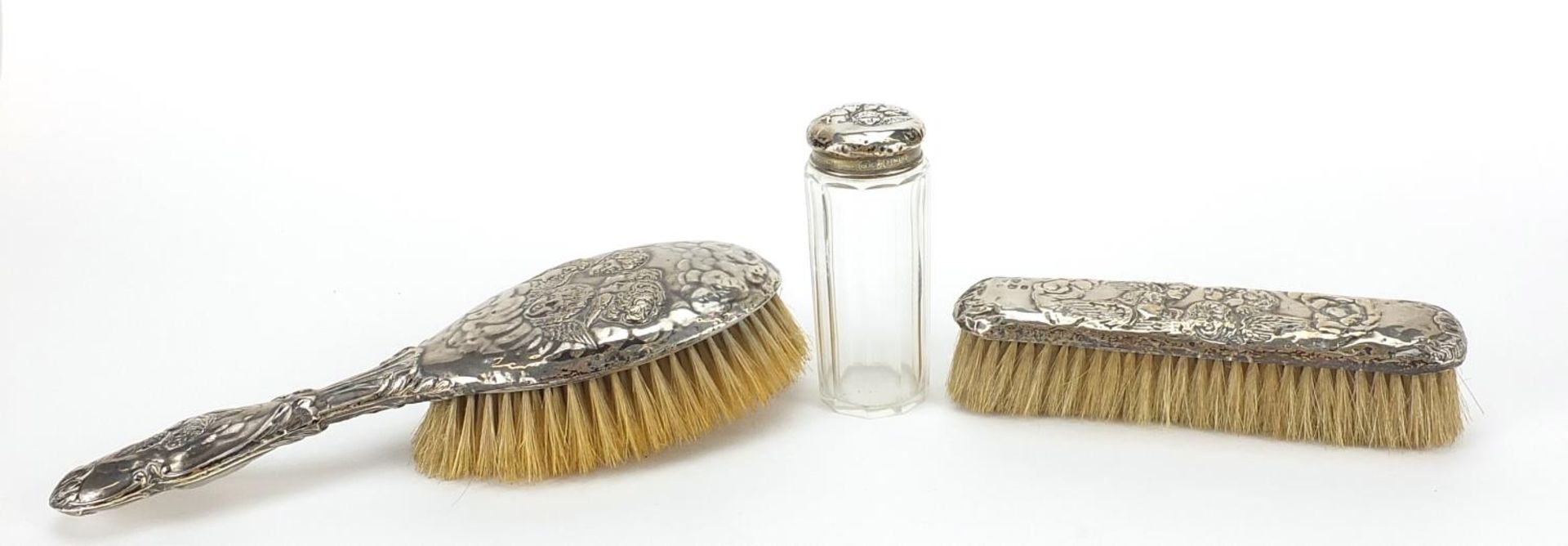 Two silver mounted brushes and a cut glass jar, each embossed with Putti, various Birmingham - Image 2 of 5