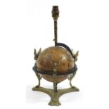 Antique brass rotating globe design table lamp with griffins and paw feet, 39cm high including the