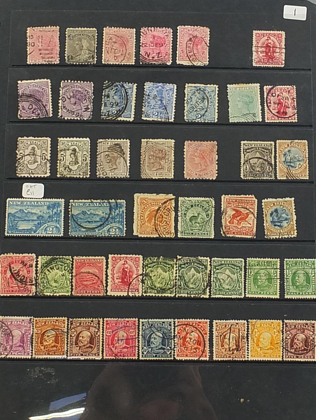 Collection of New Zealand stamps arranged in an album including Queen Victoria