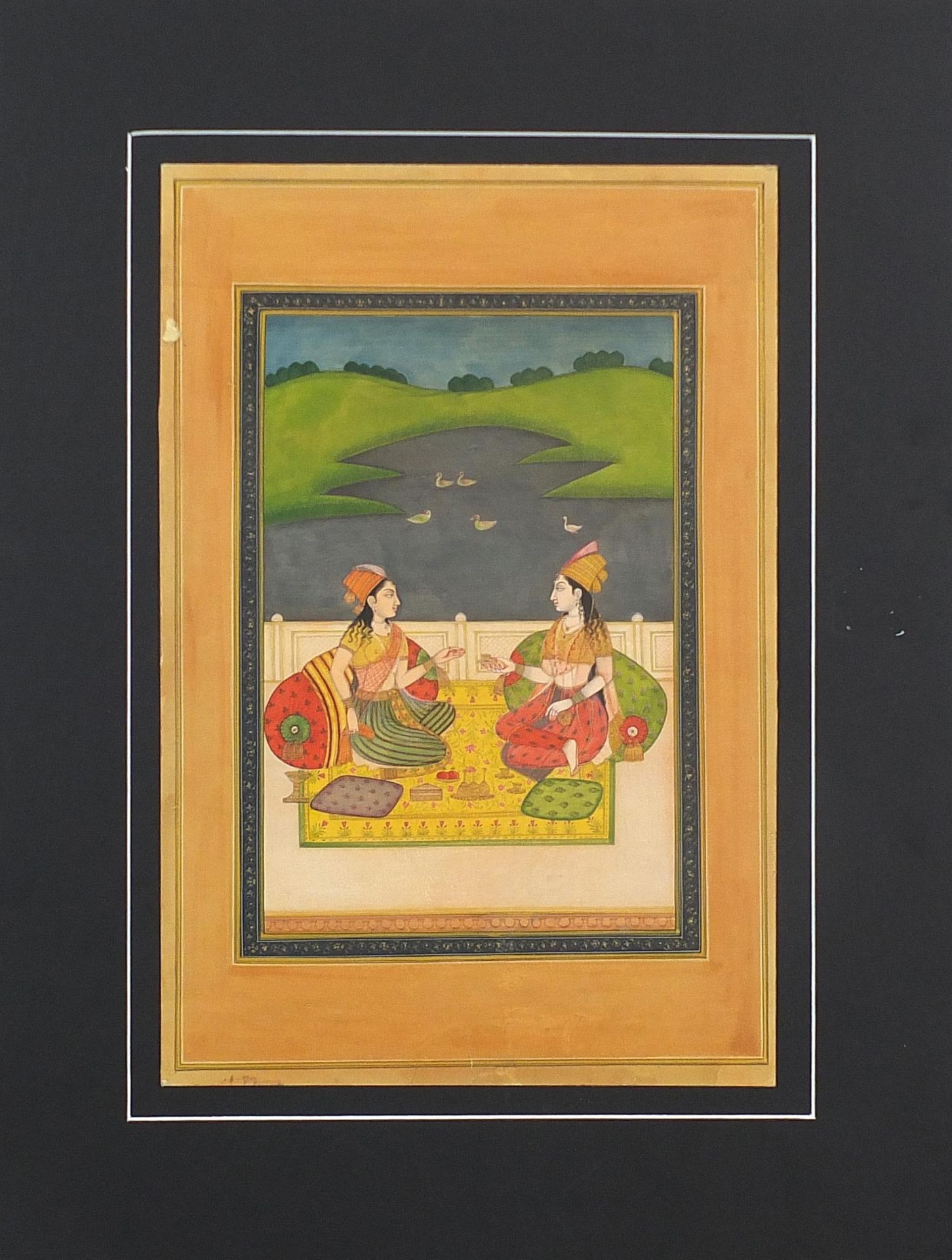 Two seated females before a landscape, Indian Mughal school watercolour on card, mounted, - Image 2 of 2