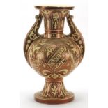 Islamic pottery lustre baluster vase with twin handles, hand painted with stylised flowers and