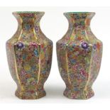 Pair of Chinese porcelain hexagonal vases decorated with flowers, character marks to the bases, 32.