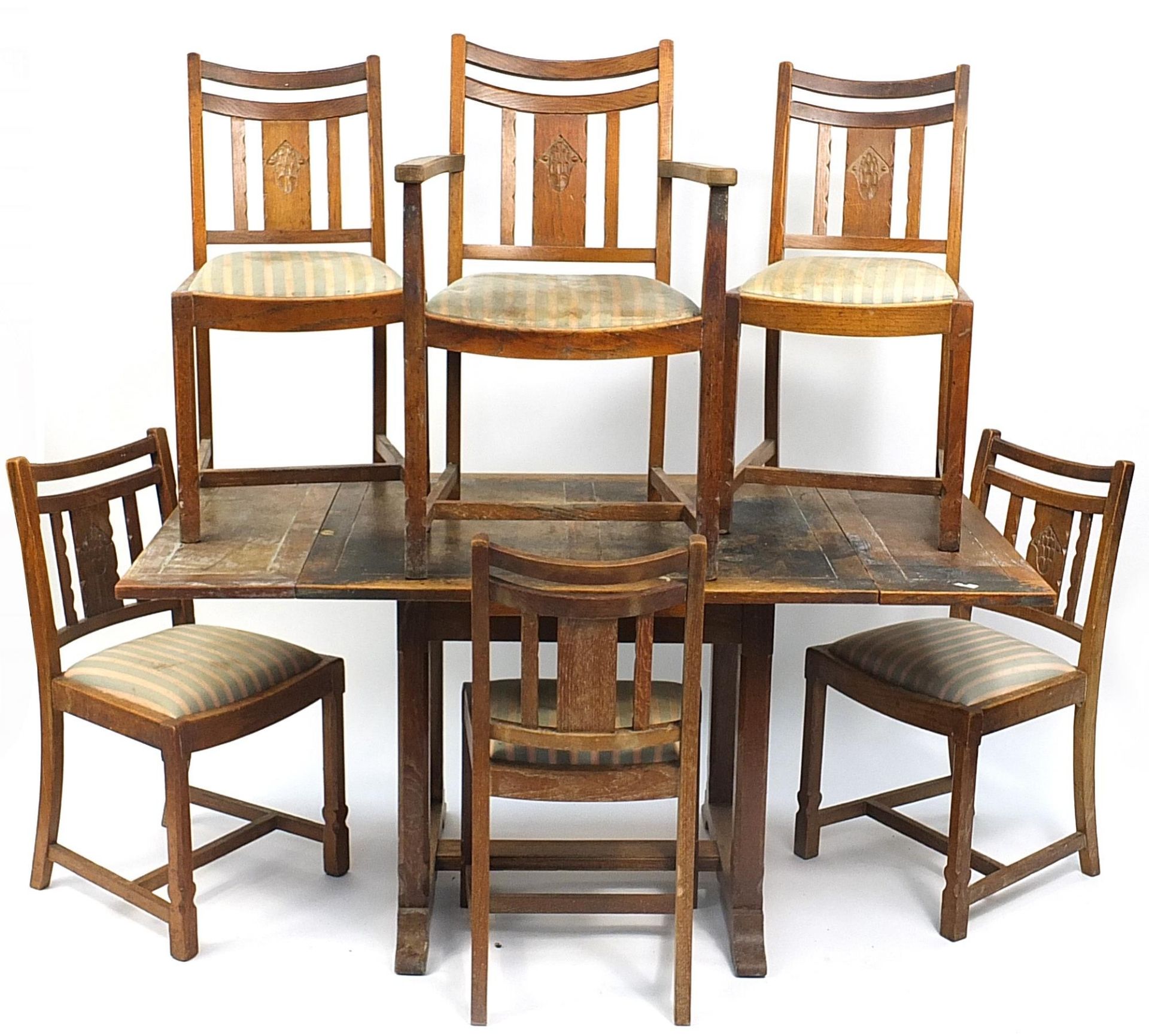 Art Deco oak draw leaf dining table with six chairs including a carver, the table 75cm H x 84cm W