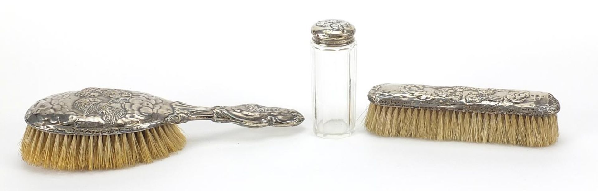 Two silver mounted brushes and a cut glass jar, each embossed with Putti, various Birmingham - Image 3 of 5