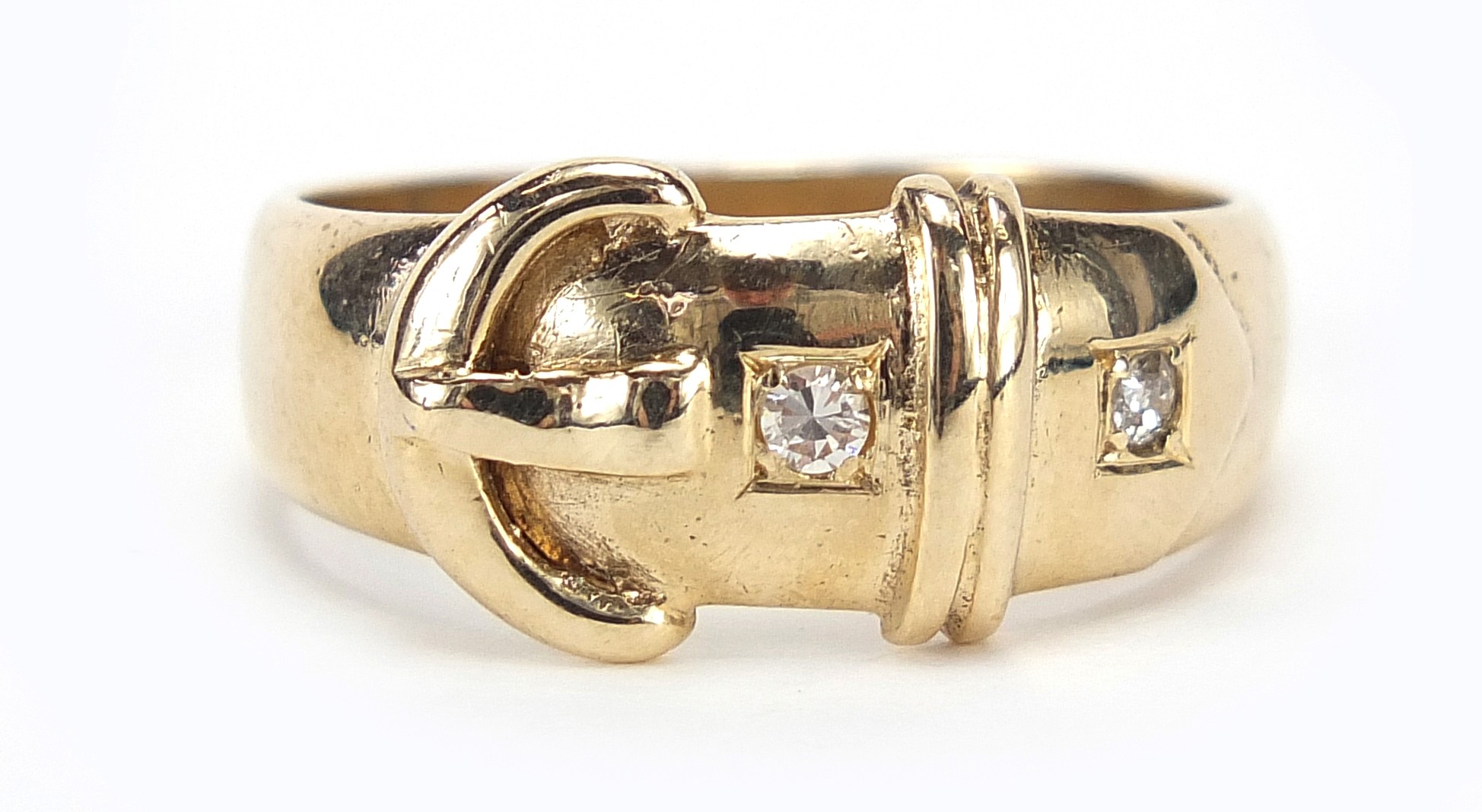 9ct gold diamond buckle ring, size U/V, 6.2g