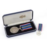 Military interest National Service medal with miniature and case