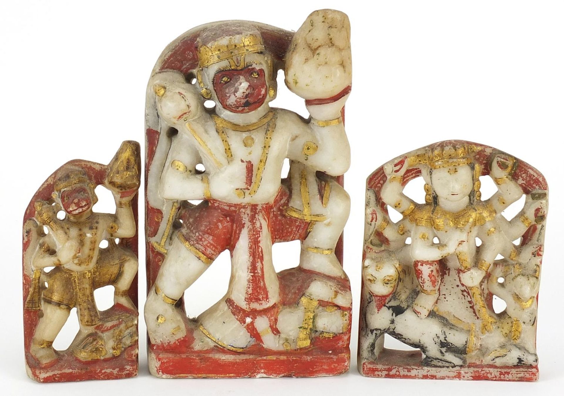 Three Indian sandstone carvings of Hanuman, the largest 21cm high