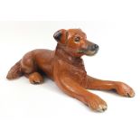 Large plaster recumbent dog, 75cm in length