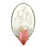 19th century oval wall mirror with cranberry and Vaseline glass sconce, the mirror etched with two