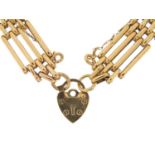 9ct gold four row gate link bracelet with love heart padlock, 18cm in length, 20.5g