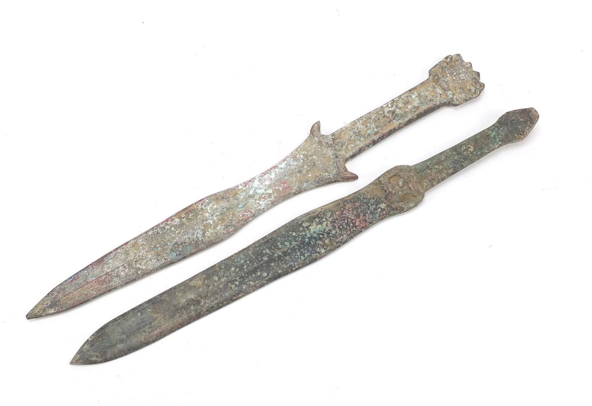 Two Chinese/Islamic patinated bronze short swords, the largest 39cm in length,