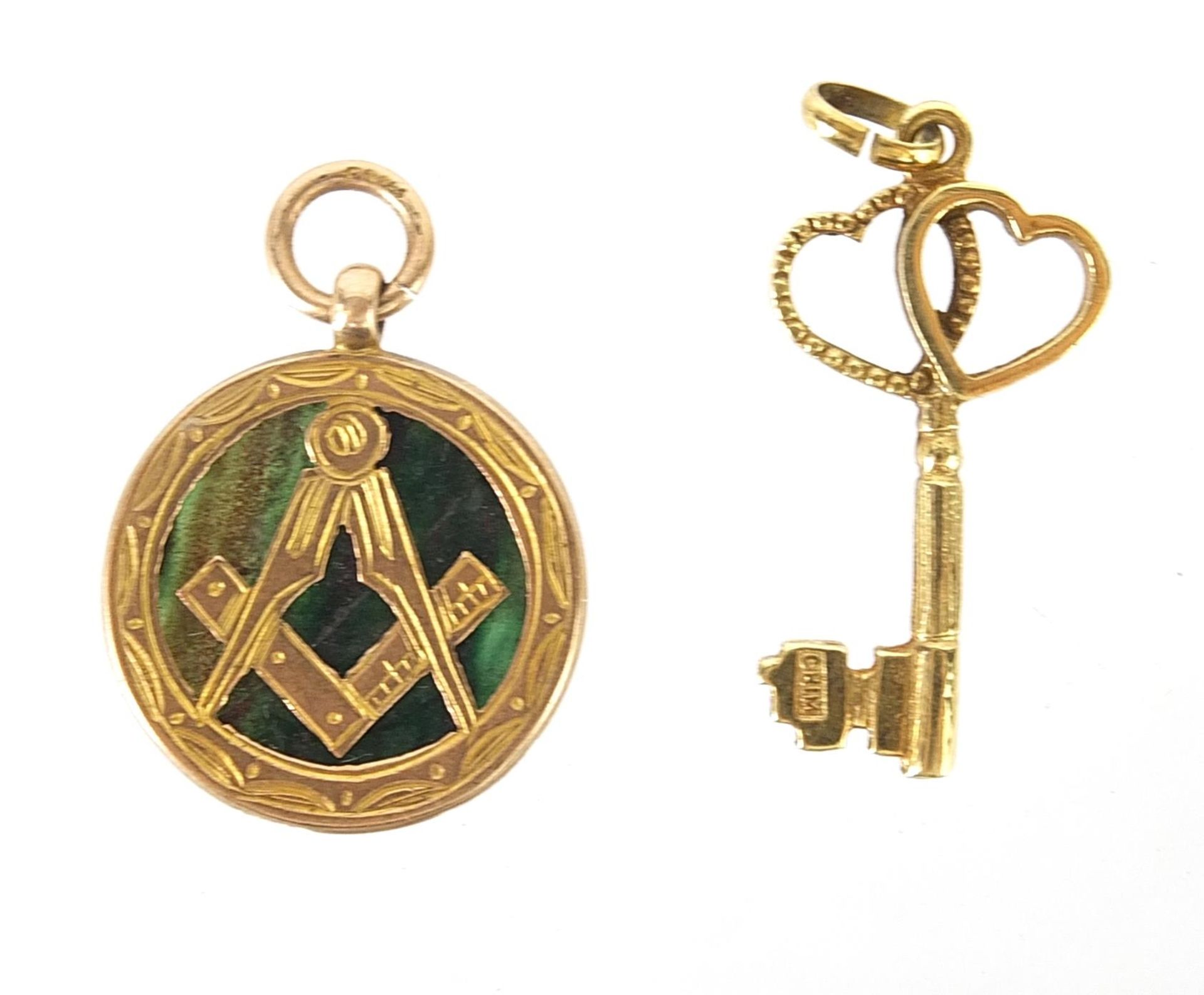 9ct gold hardstone masonic pendant and a 9ct gold love heart key pendant, 2.5cm and 2cm high,
