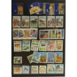 Collection of New Zealand stamps arranged in an album and a black stock sheet of unmounted stamps