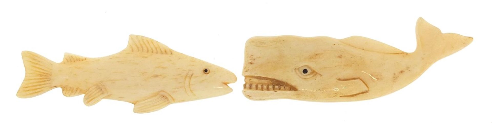 Two carved bone animals including a whale, the largest 8cm in length