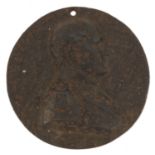 Cast iron circular medallion of a gentleman in military uniform, 10cm in diameter