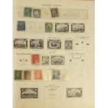 World stamps arranged in an album including Great Britain, East Africa and Canada