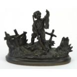 Patinated bronze figure of a boy holding game, 11cm wide