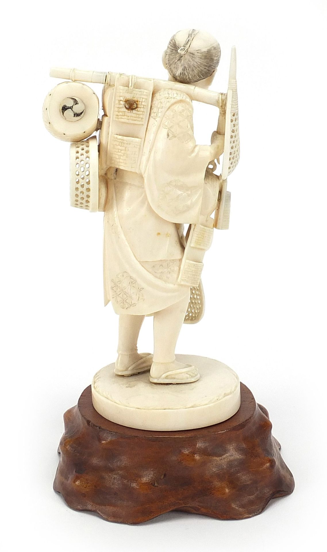 Good Japanese carved ivory okimono of a fisherman raised on a hardwood stand, inset red plaque - Image 4 of 9