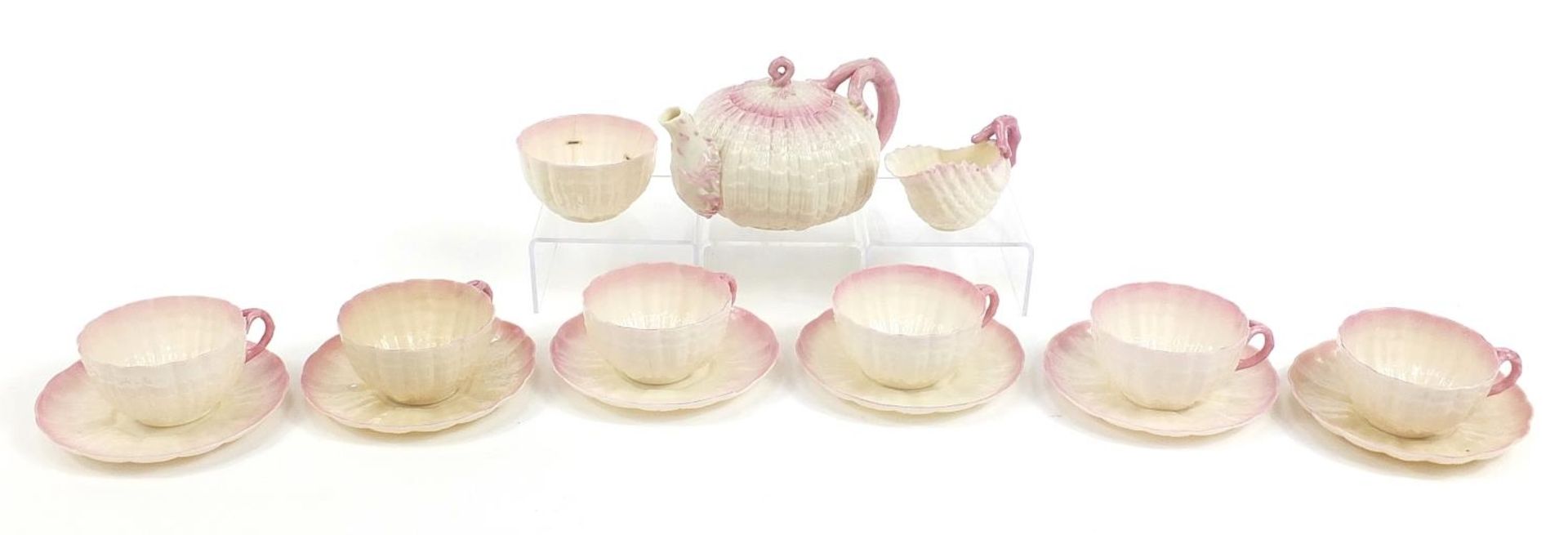 Belleek, Irish porcelain shell design six place tea service comprising teapot, six cups with