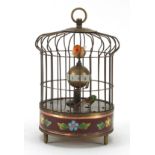 Brass and cloisonne clockwork automaton bird cage with alarm clock, 19cm high