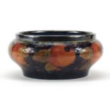 William Moorcroft pottery bowl with silver plated rim hand painted with flowers, 21cm in diameter