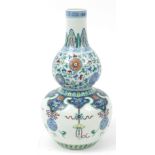 Large Chinese doucai porcelain double gourd vase hand painted with Daoist emblems and flower heads